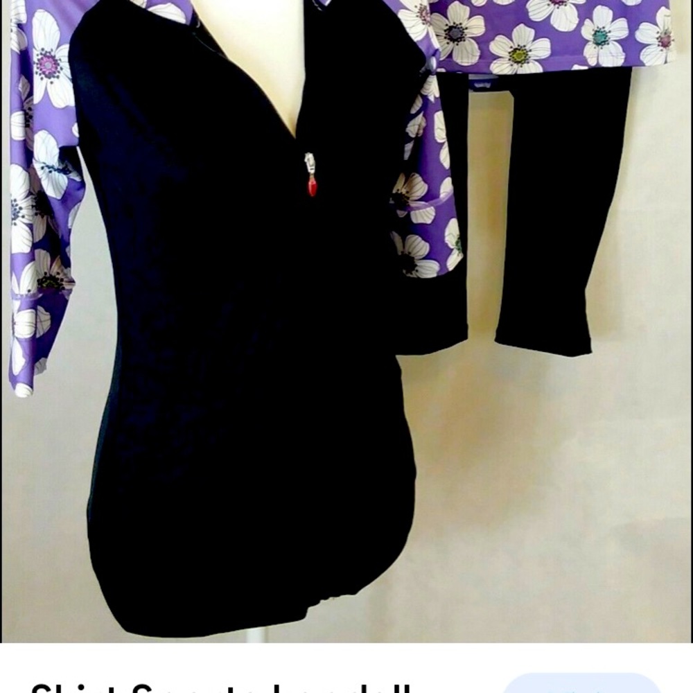 Skirt sports Kendall by Jackie.  3/4 length sleeves, zip front, pockets. WMed